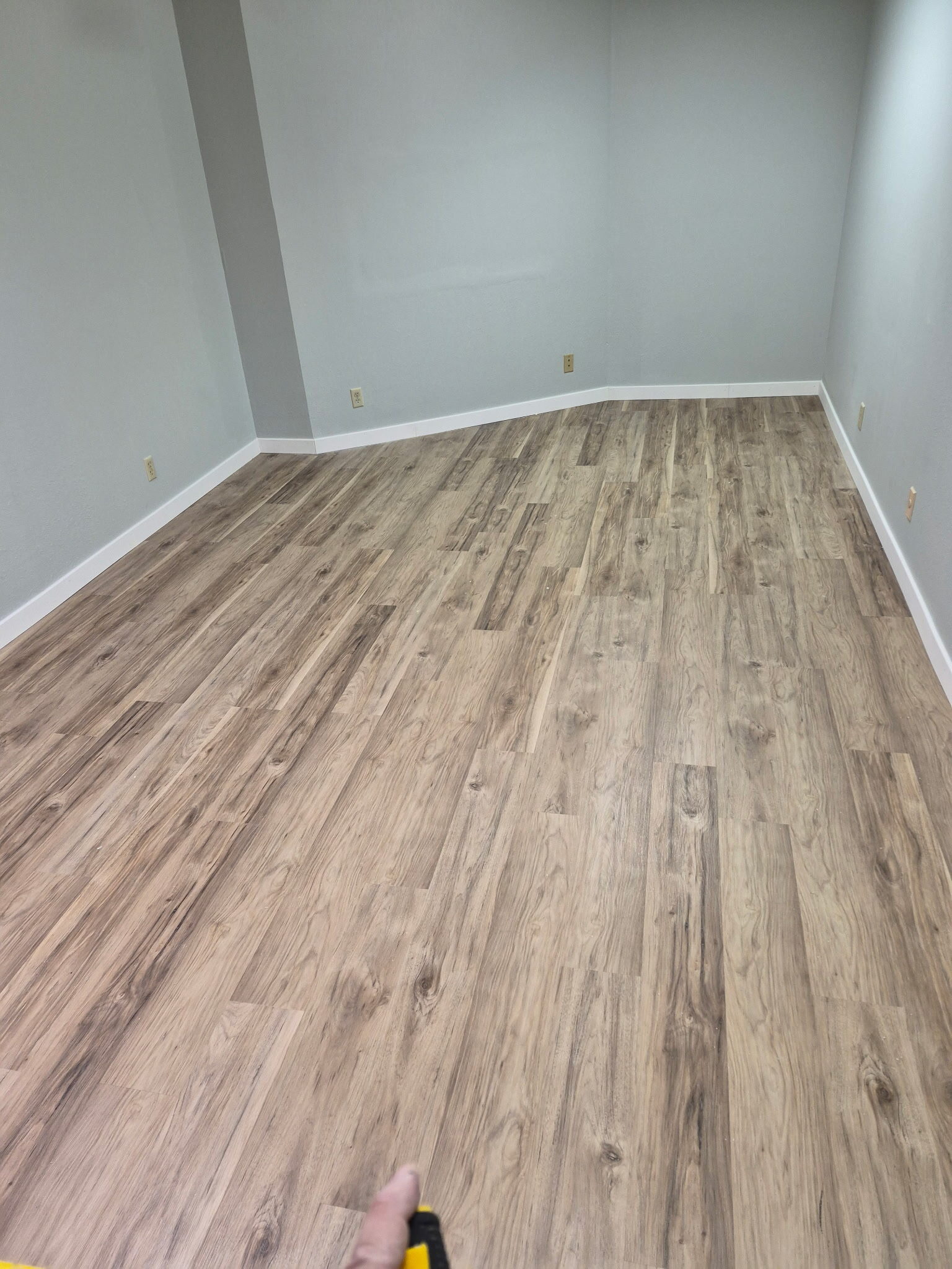 New LVP flooring installed across large empty room