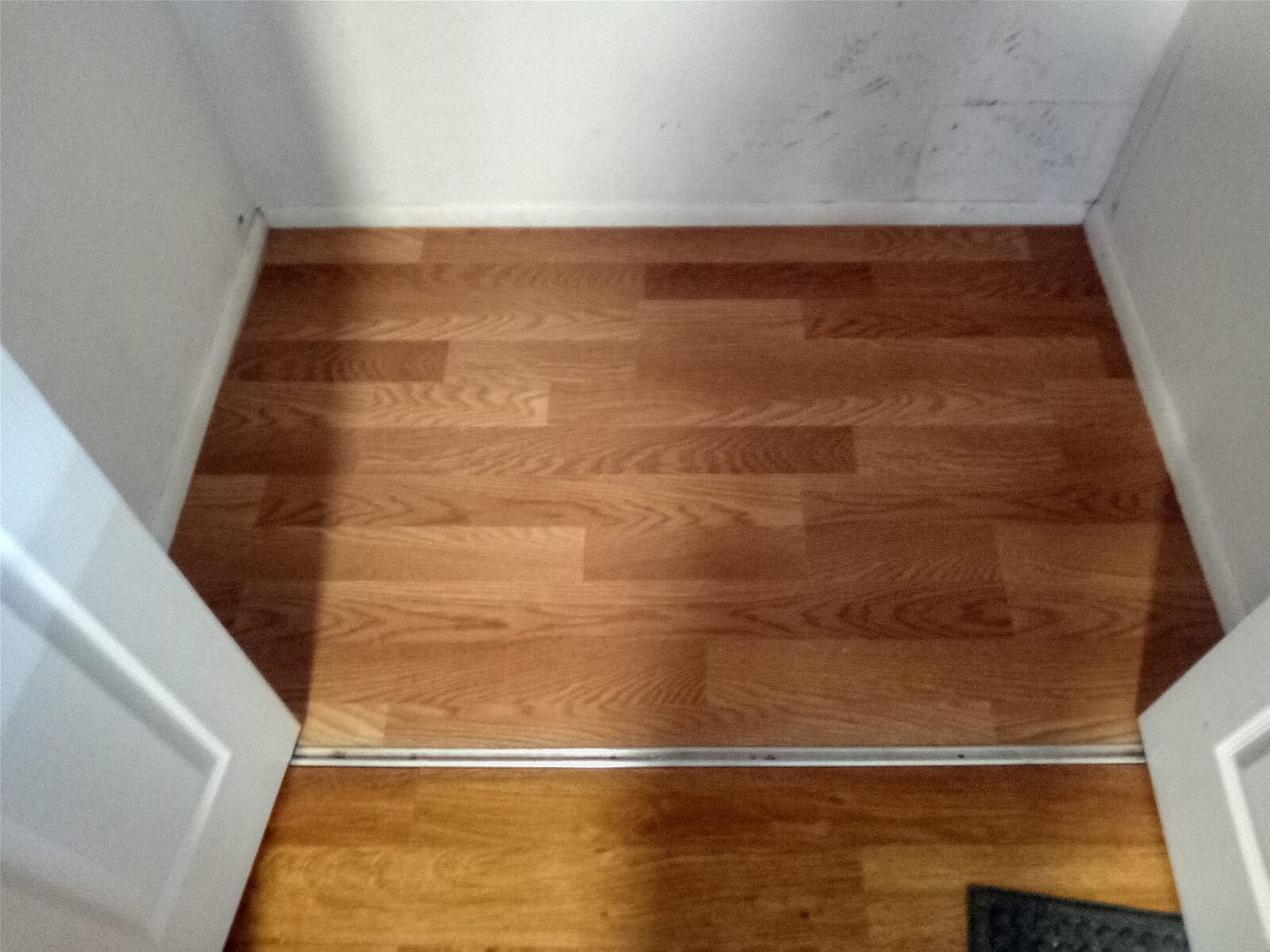 Hardwood flooring with threshold